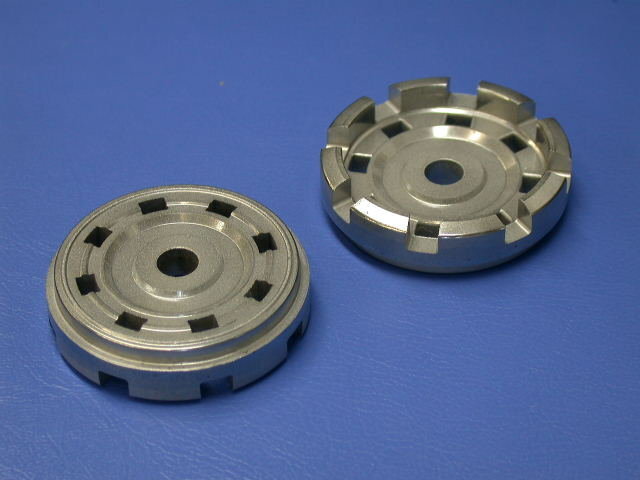 Cost reduction by chamfering outer corners of both end faces of base valve case by using press machine